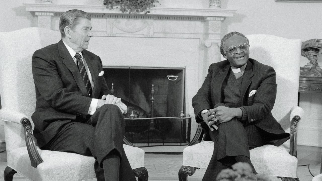 (Original Caption) Washington, D.C.: President Reagan meets with Nobel Prize winning Bishop Desmond Tutu in the Oval Office. Tutu has denounced the Reagan administration's policy towards the South African government as "immoral" and "un-Christian."