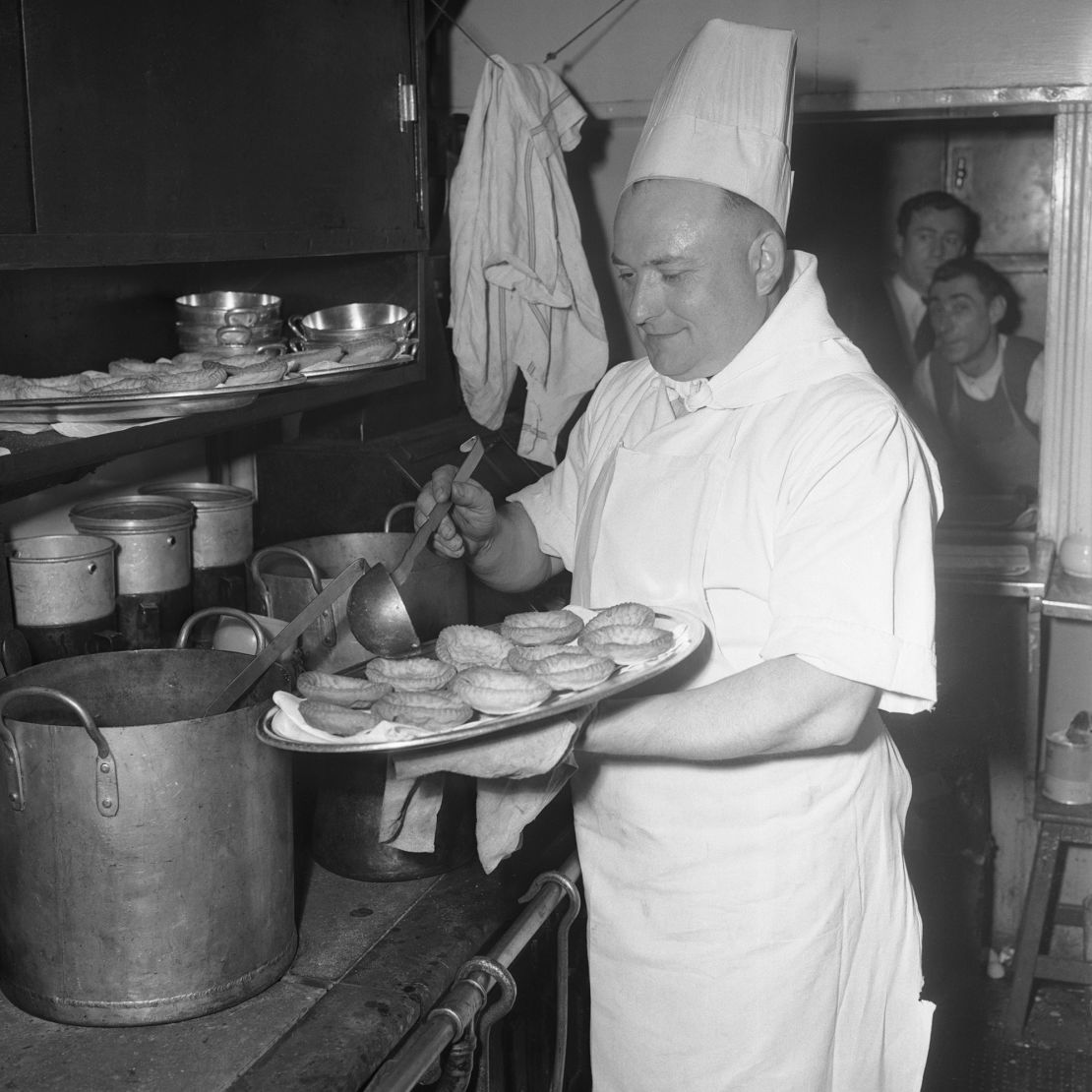 A dining car chef prepares pastries aboard the Simplon Orient Express — a variation of the original route, introduced after the opening of the Simplon Tunnel connecting Switzerland and Italy — in 1951.