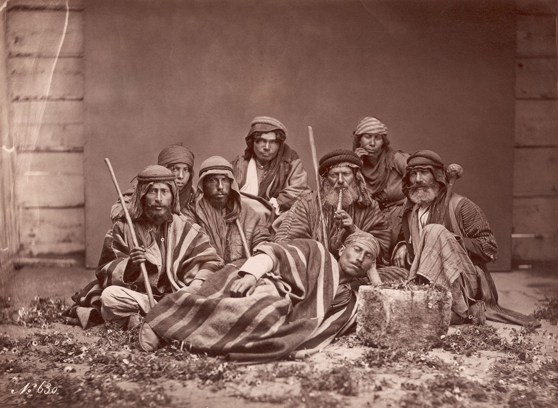 Historians trace the history of the keffiyeh to nomadic Bedouin farmers in historic Palestine, who use the scarves as protection from the sun and sand.