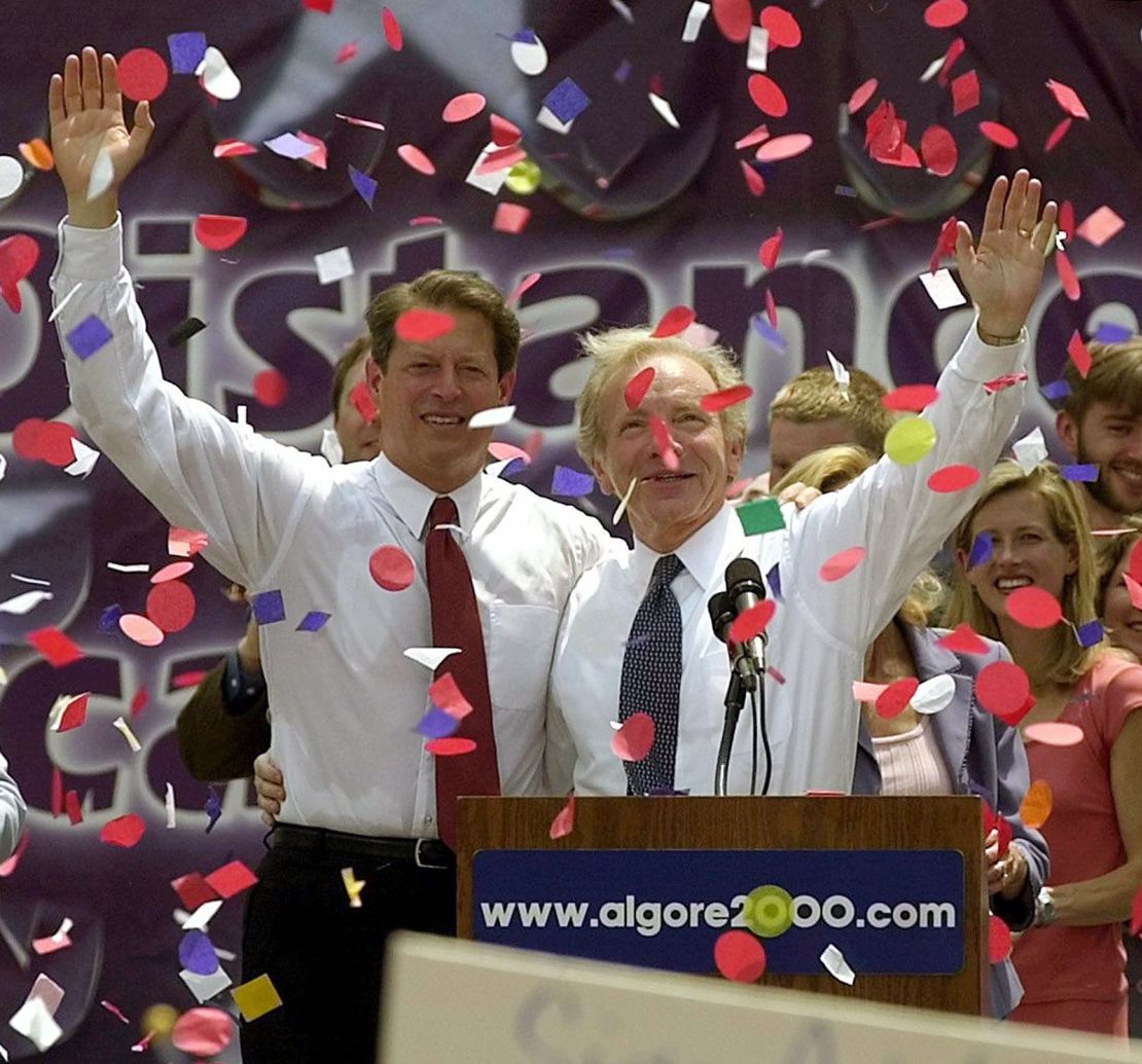 US Vice President and Democratic Presidential Candidate Al Gore (L) and US Senator Joseph Lieberman (R) salute the crowd at a rally where Gore formally announced Lieberman as his vice presidential running mate in Nashville, Tennessee, 08 August 2000.