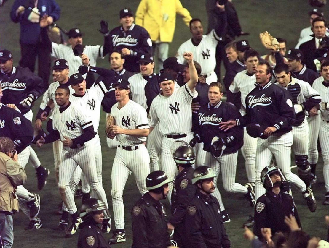 The New York Yankees celebrate after beating the Atlanta Braves 3-2 in Game 6 to win the 1996 World Series at Yankee Stadium.