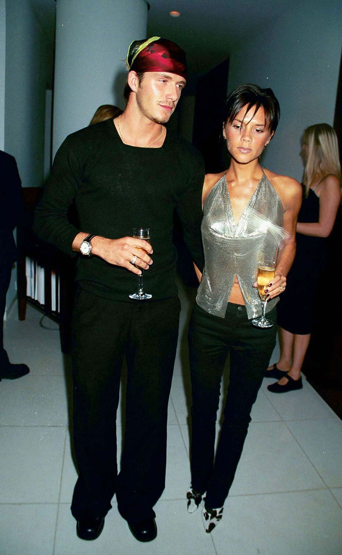 In 1999, the Beckhams attended the launch of Jade Jagger’s jewelry line in London. David wore a silk headscarf, while Victoria stepped out in cow-print heels and a halter-neck chainmail top.