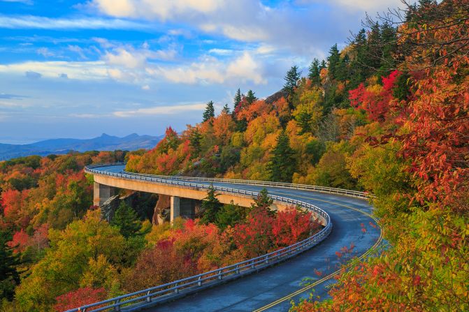 <strong>1. Blue Ridge Parkway:</strong> Fall colors vividly pop in this photo of the parkway in the North Carolina portion of its route. (The parkway continues into Virginia). Nearly 16.8 million people paid recreational visits to the parkway in 2023, making it the No. 1 US National Park Service site.