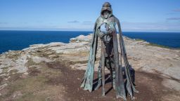 TINTAGEL, UNITED KINGDOM - APRIL 28:  The new 'Gallos' sculpture that has been erected at Tintagel Castle is seen in Tintagel on April 28, 2016 in Cornwall, England. The English Heritage managed site and the nearby town have long been associated with the legend of King Arthur and continue to attract large visitor numbers. However, efforts by English Heritage to update the visitor experience with the Gallos sculpture, along with a rock carving of Merlin's face, which English Heritage say are inspired by the legend of King Arthur and Tintagel Castles royal past, have met with criticism from some Cornish nationalists and historians. (Photo by Matt Cardy/Getty Images)
