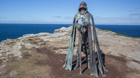 TINTAGEL, UNITED KINGDOM - APRIL 28:  The new 'Gallos' sculpture that has been erected at Tintagel Castle is seen in Tintagel on April 28, 2016 in Cornwall, England. The English Heritage managed site and the nearby town have long been associated with the legend of King Arthur and continue to attract large visitor numbers. However, efforts by English Heritage to update the visitor experience with the Gallos sculpture, along with a rock carving of Merlin's face, which English Heritage say are inspired by the legend of King Arthur and Tintagel Castles royal past, have met with criticism from some Cornish nationalists and historians. (Photo by Matt Cardy/Getty Images)