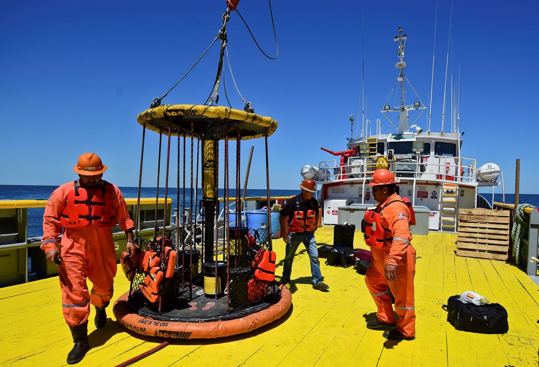 Workers load supplies for the the L/B Myrtle offshore support vessel, part of a 2016 scientific mission led by the International Ocean Discovery Program to study the Chicxulub impact crater on the Gulf of Mexico. The crater was formed after an asteroid hit Earth 66 million years ago.
