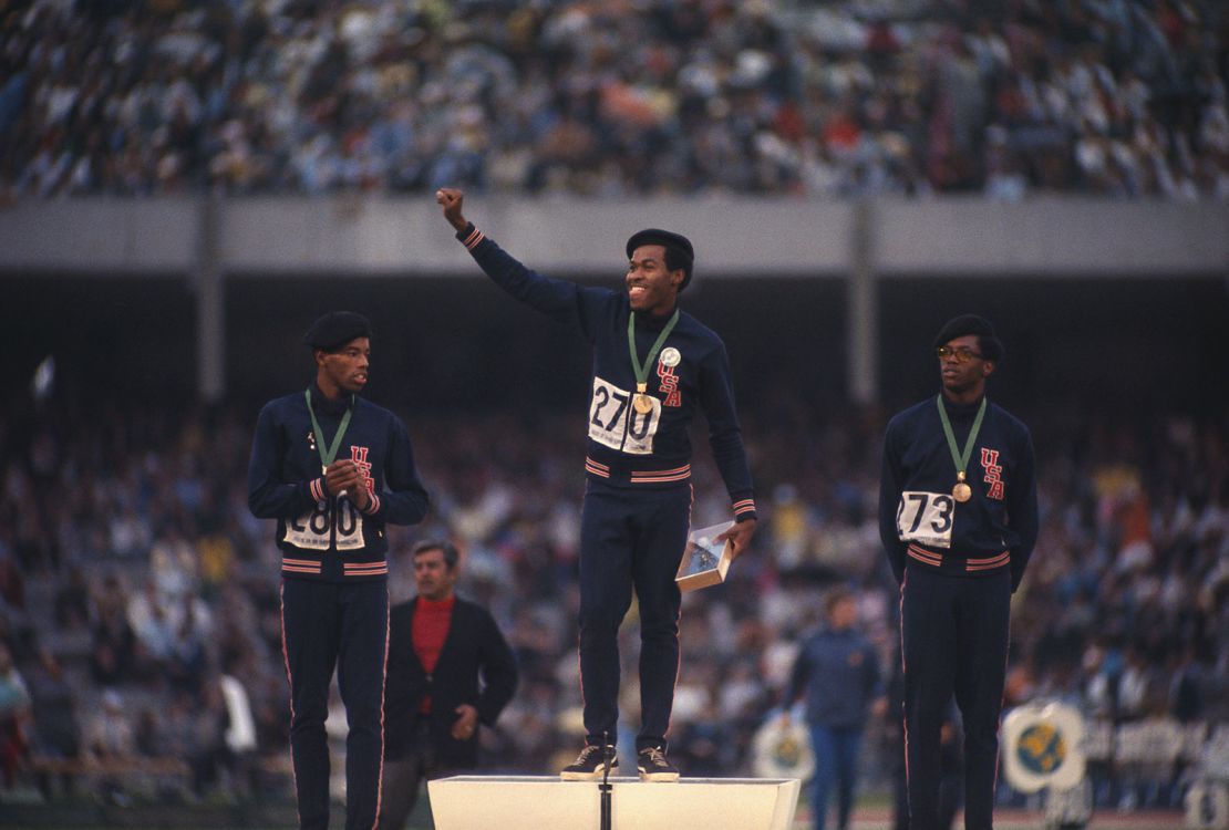 American sprinters, from left to right,  Larry James, Lee Evans and Ronald Freeman III, stand on the winner's podium at the 1968 Olympic games in Mexico City.  The men are wearing black berets to represent Black Power at a time when many African Americans were protesting and boycotting the 1968 Olympics because of racial discrimination and human rights issues.