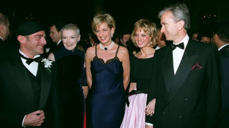 British fashion designer of Dior John Galliano, British fashion magazine editor Liz Tilberis, Lady Diana, Pricess of Wales, CEO of the French conglomerate LVMH Bernard Arnault and his wife Hélène Arnault, attend the 50th Anniversary of The House of Dior, (founded on December 16, 1946) at the Metropolitan Museum of Art, in New York. (Photo by Stephane Cardinale/Sygma via Getty Images)