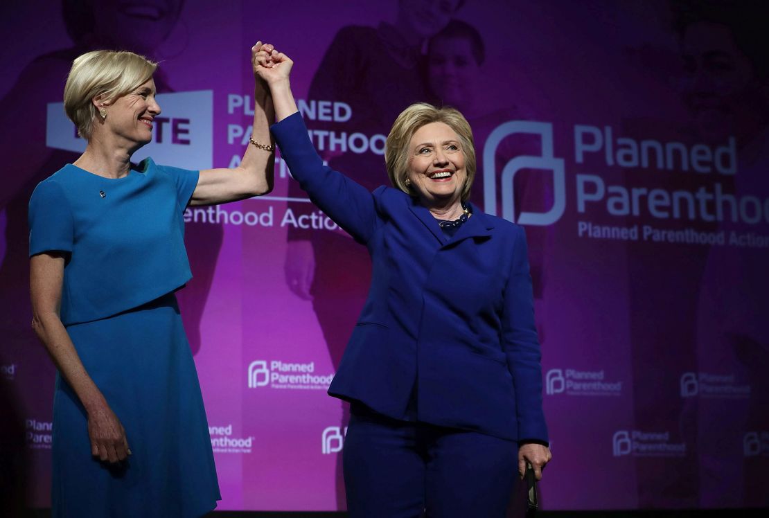 Then-presumptive Democratic presidential nominee Hillary Clinton holds hands with Cecile Richards, president of Planned Parenthood Action Fund, during a June 2016 event in Washington, DC.