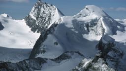 The snow-capped peaks of Rimpfischhorn (left) and Allalinhorn in the Valais Alps, Switzerland.