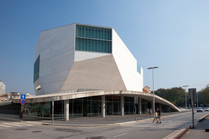 Designed in 1999 and completed in 2005, OMA's Casa da Musica is a concert hall with a difference. Located in Porto, Portugal, its white concrete shape looks like a rough-cut gem, a world apart from the old buildings surrounding it. Inside, the auditorium seats 1,300 guests, while the concert hall forgoes traditional design elements like a large foyer.