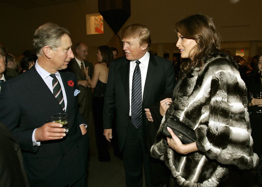 Britain's then-Prince Charles talks with Donald Trump and his wife Melania during a reception at the Museum of Modern Art in New York in 2005.
