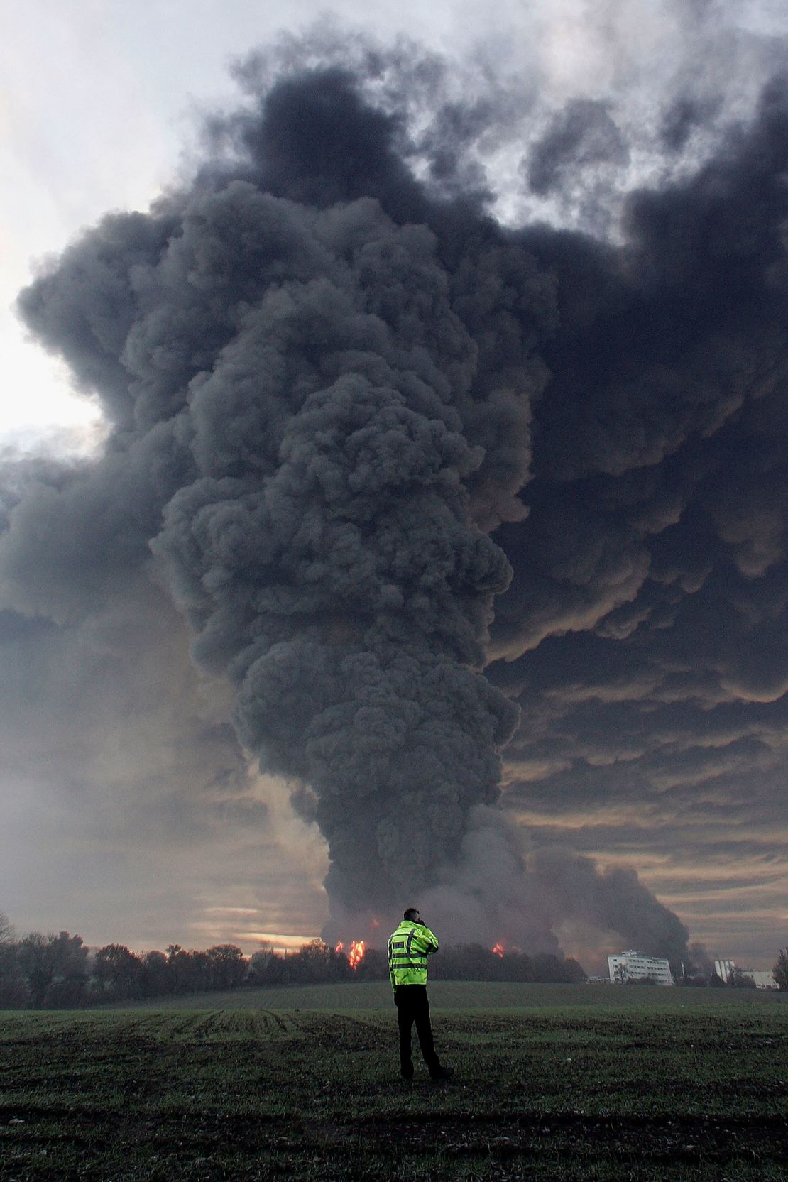 Smoke rises from the Buncefield facility following the 2005 explosion.