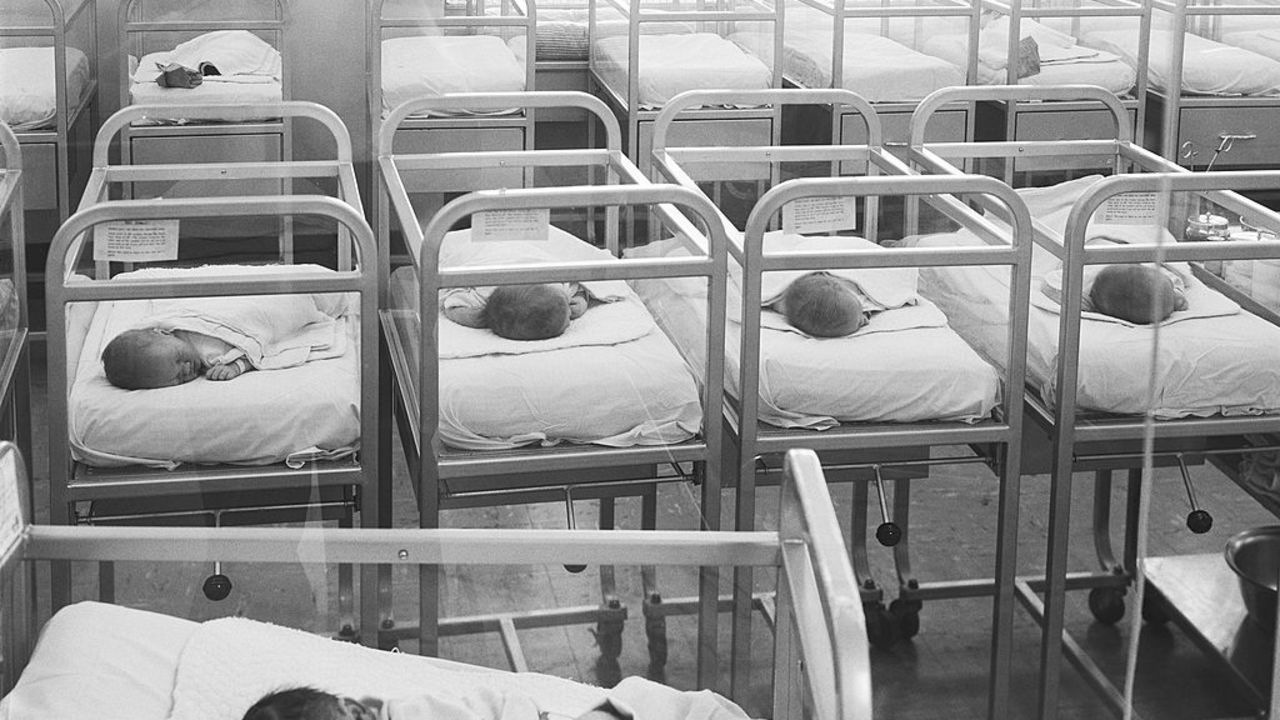 UNITED STATES - CIRCA 1960s:  Newborn baby cribs in hospital nursery.  (Photo by H. Armstrong Roberts/Retrofile/Getty Images)