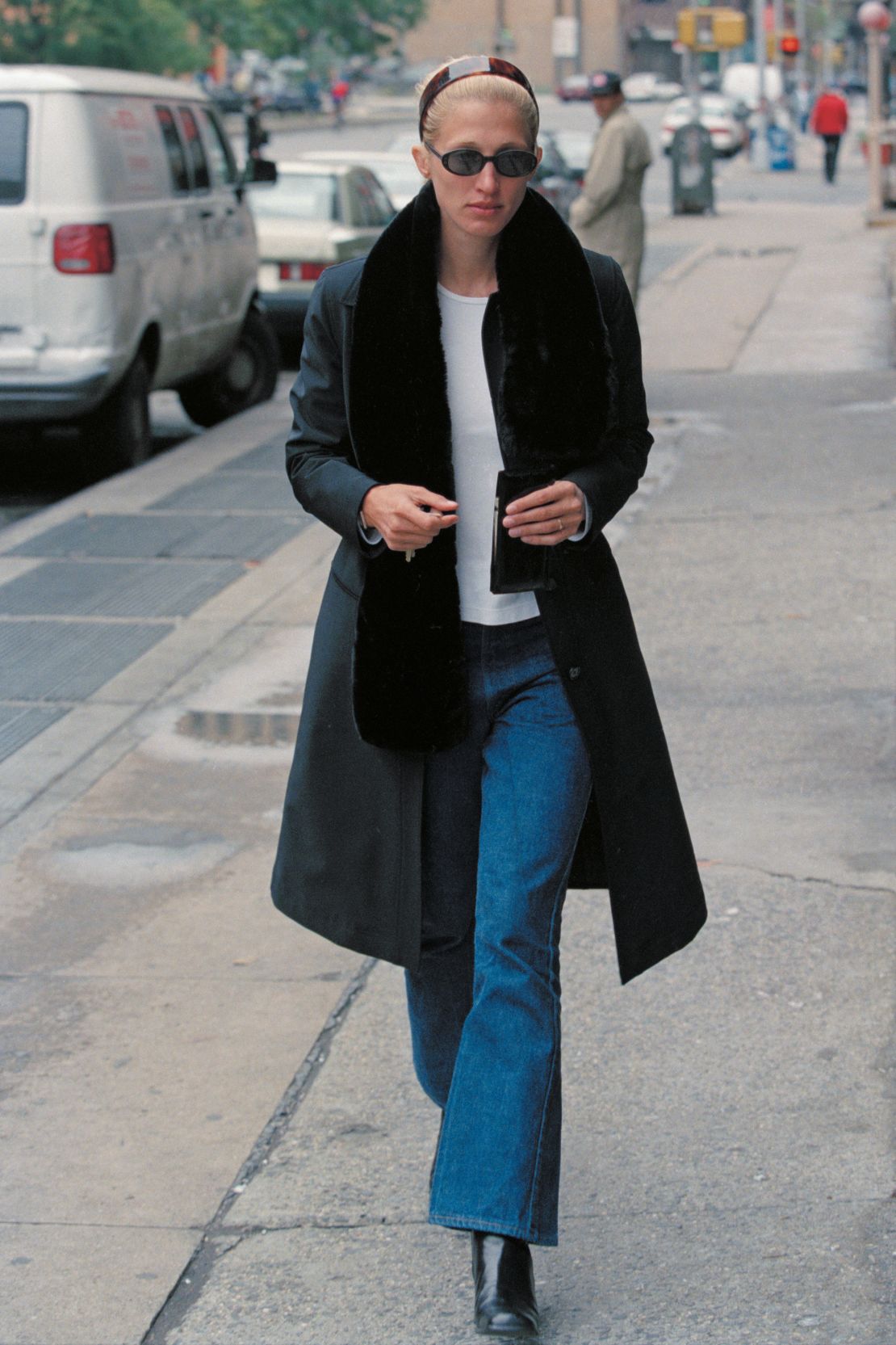 A tortoise shell headband and kick-flare jeans are among the key elements of Bessette-Kennedy's signature look.