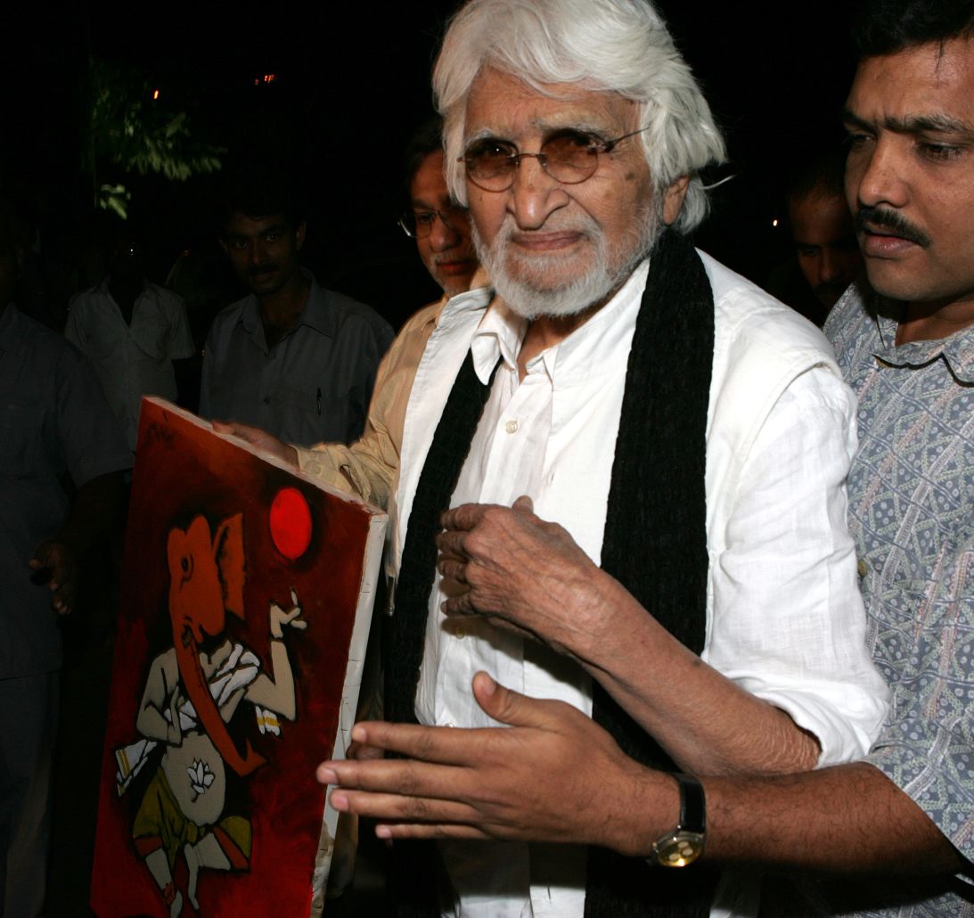 Hussain pictured with a painting of the Hindu god Ganesha that he presented to actor Amitabh Bachchan at a Mumbai hospital.