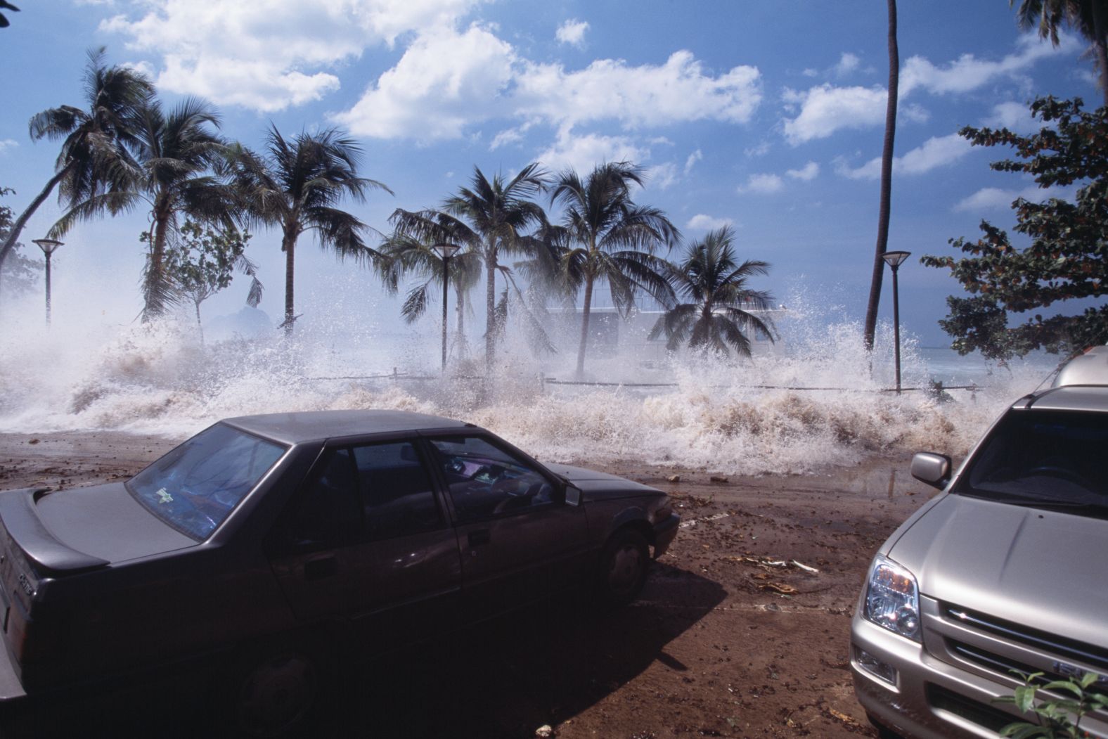 A tsunami wave hits the promenade on Thailand's Ao Nang Beach on December 26, 2004.