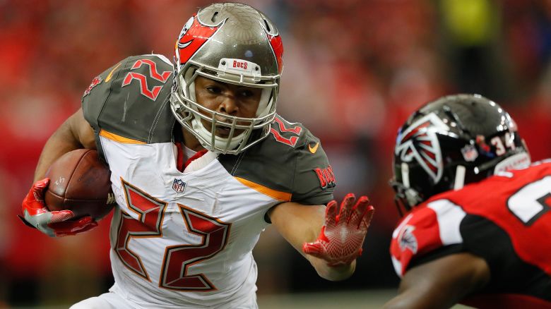 ATLANTA, GA - SEPTEMBER 11:  Doug Martin #22 of the Tampa Bay Buccaneers looks to stiff arm Brian Poole #34 of the Atlanta Falcons at Georgia Dome on September 11, 2016 in Atlanta, Georgia.  (Photo by Kevin C. Cox/Getty Images)