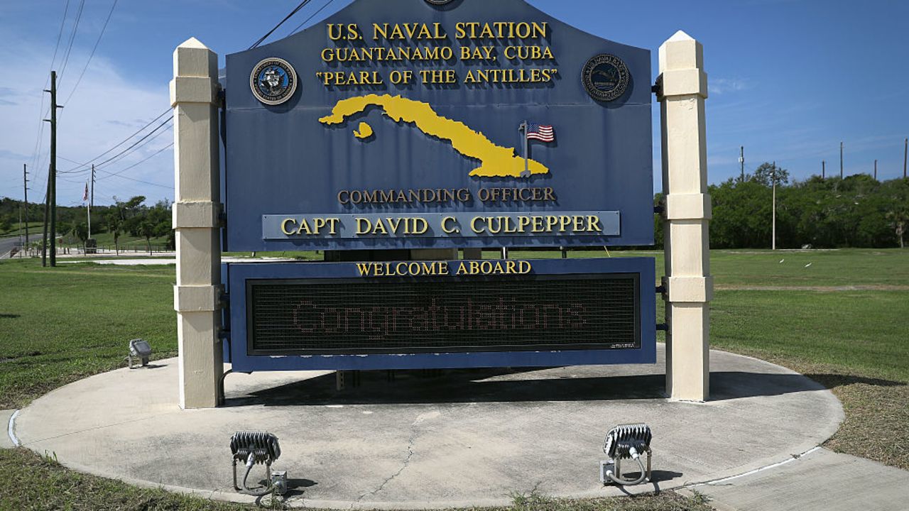 GUANTANAMO BAY, CUBA - OCTOBER 23: (EDITORS NOTE: Image has been reviewed by the U.S. Military prior to transmission.) A sign welcomes military personnel to the U.S. Naval Station at Guantanamo Bay, also known as "Gitmo" on October 23, 2016 at Guantanamo Bay, Cuba. The U.S. military's t Task Force Guantanamo is holding 60 detainees at the U.S. prison, located on the naval base, down from a previous total of 780. In 2008 President Obama issued an executive order to close the prison, which has failed because of political opposition in the U.S. (Photo by John Moore/Getty Images)