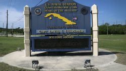 GUANTANAMO BAY, CUBA - OCTOBER 23:  (EDITORS NOTE: Image has been reviewed by the U.S. Military prior to transmission.) A sign welcomes military personnel to the U.S. Naval Station at Guantanamo Bay, also known as "Gitmo" on October 23, 2016 at Guantanamo Bay, Cuba. The U.S. military's t Task Force Guantanamo is holding 60 detainees at the U.S. prison, located on the naval base, down from a previous total of 780. In 2008 President Obama issued an executive order to close the prison, which has failed because of political opposition in the U.S.  (Photo by John Moore/Getty Images)