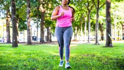Plus size women jogging and exercising at the park and walking outdoor in the city streets in Chicago, United States - USA. Weight loss concept