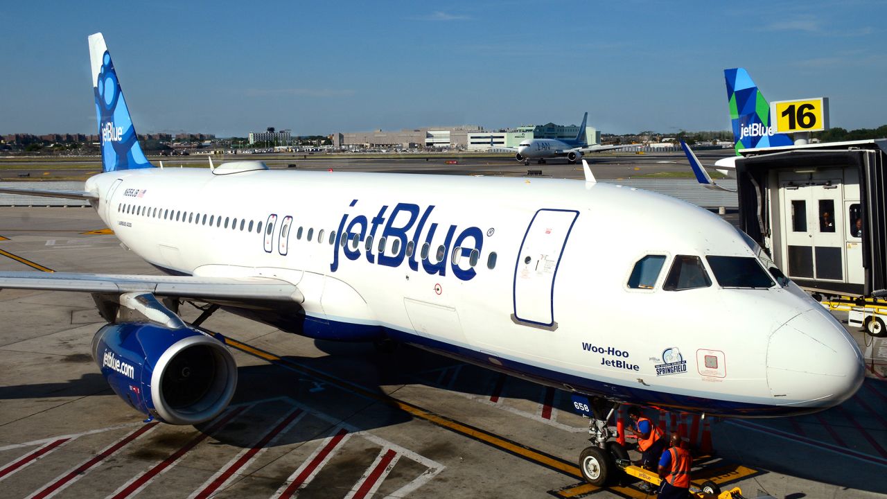 NEW YORK, NY - August 27, 2016:  A JetBlue Airways Airbus A320 passenger plane is serviced at a gate at John F. Kennedy International Airport.  JFK International Airport is in the borough of Queens in New York City. (Photo by Robert Alexander/Getty Images)