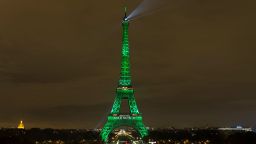 PARIS, FRANCE - NOVEMBER 04: The Eiffel Tower is illuminated in green to celebrate the ratification of the COP21 (Conference of the Parties Climate Conference) climate change agreement in Paris, France on November 04, 2016.  (Photo by Geoffroy Van Der Hasselt/Anadolu Agency/Getty Images)