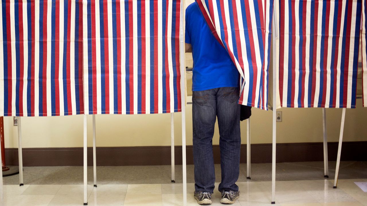 PORTLAND, ME - NOVEMBER 8: Voters fill out their ballots in the patriotic voting booths at Merrill Auditorium with a hour and 20 minutes to go before the polls close. (Photo by Brianna Soukup/Portland Portland Press Herald via Getty Images)