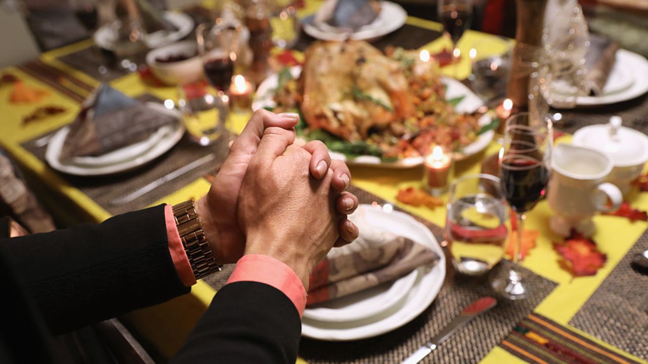 STAMFORD, CT - NOVEMBER 24: Central American immigrants and their families pray before Thanksgiving dinner on November 24, 2016 in Stamford, Connecticut. Family and friends, some of them U.S. citizens, others on work visas and some undocumented immigrants came together in an apartment to celebrate the American holiday with turkey and Latin American dishes. They expressed concern with the results of the U.S. Presidential election of president-elect Donald Trump, some saying their U.S.-born children fear the possibilty their parents will be deported after Trump's inauguration. (Photo by John Moore/Getty Images)