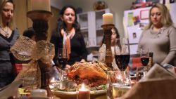 STAMFORD, CT - NOVEMBER 24: Central American immigrants and their families pray before Thanksgiving dinner on November 24, 2016 in Stamford, Connecticut. Family and friends, some of them U.S. citizens, others on work visas and some undocumented immigrants came together in an apartment to celebrate the American holiday with turkey and Latin American dishes. They expressed concern with the results of the U.S. Presidential election of president-elect Donald Trump, some saying their U.S.-born children fear the possibilty their parents will be deported after Trump's inauguration. (Photo by John Moore/Getty Images)