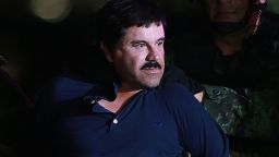 Joaquin Guzman, the world's most wanted drug trafficker, is escorted by Mexican security forces at a Navy hangar in Mexico City, Mexico, on Jan. 8, 2016.