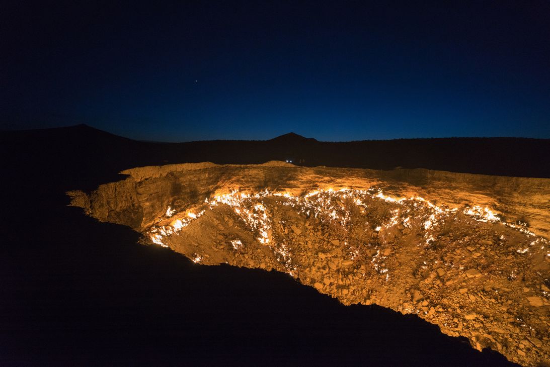 The most common theory is that the crater formed in 1971 and was lit on fire shortly thereafter to prevent spreading methane gas, and it has been burning ever since.