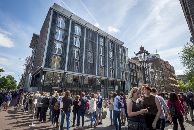 Tourists line up outside the Anne Frank house in Amsterdam.