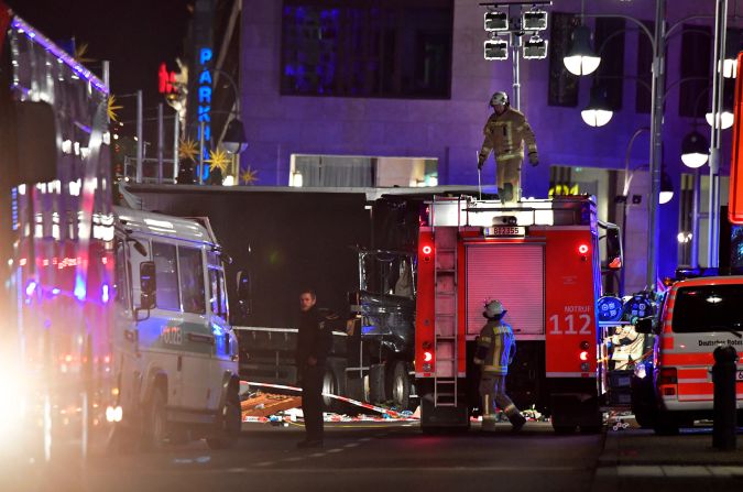 Emergency crews work near the crash site on December 19.