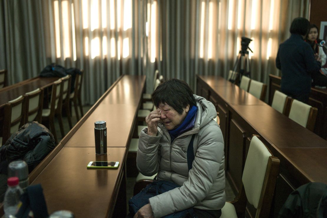A relative of missing Chinese passengers cries before a meeting in Beijing on January 18, 2017, a day after authorities announced the end of search operations for MH370.
