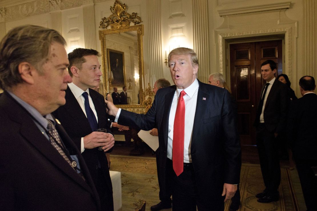 Then-President Donald Trump greets Elon Musk before a policy and strategy forum with executives at the White House in February 2017. Trump has said if he's reelected he'd consider putting Musk in a Cabinet post or an advisor position focused on government efficiency.