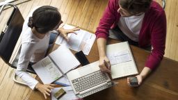Key ways to diffuse money disagreements with your spouse is to keep focus on shared goals and show empathy toward your partner even when you don't agree with them, experts say.