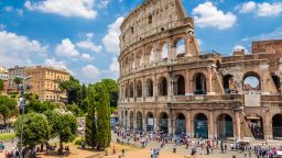 Colosseum with clear blue sky and clouds, Rome. Panorama