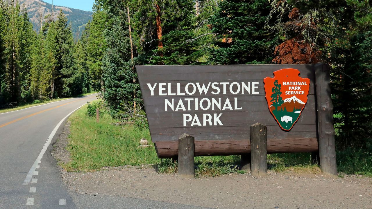 Entrance sign along U.S. Highway 212 at the northeast entrance into Yellowstone National Park in Wyoming.