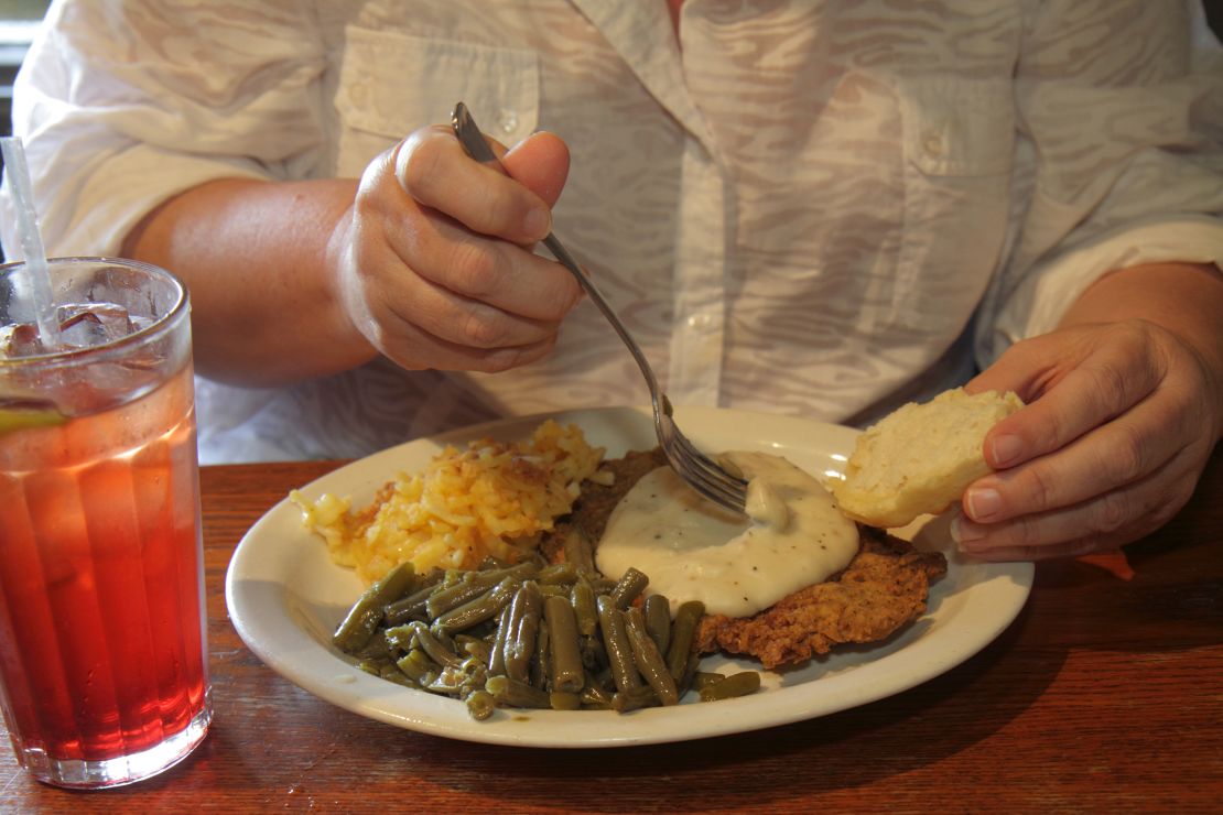 A woman eats lunch at Cracker Barrel.