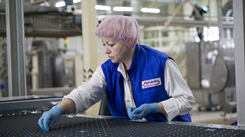 A worker removes imperfect Oreo biscuits during control checks on the production line at the Trostyanets confectionery plant, operated by Mondelez International Inc., in Trostyanets, Ukraine, on Thursday, April 6, 2017. Mondelez International Inc. bucked Russias recession to expand retail sales there by a double-digit percentage last year after starting to produce Oreo cookies as well as sweets blending chocolate and crackers, the companys regional manager said. Photographer: Vincent Mundy/Bloomberg via Getty Images