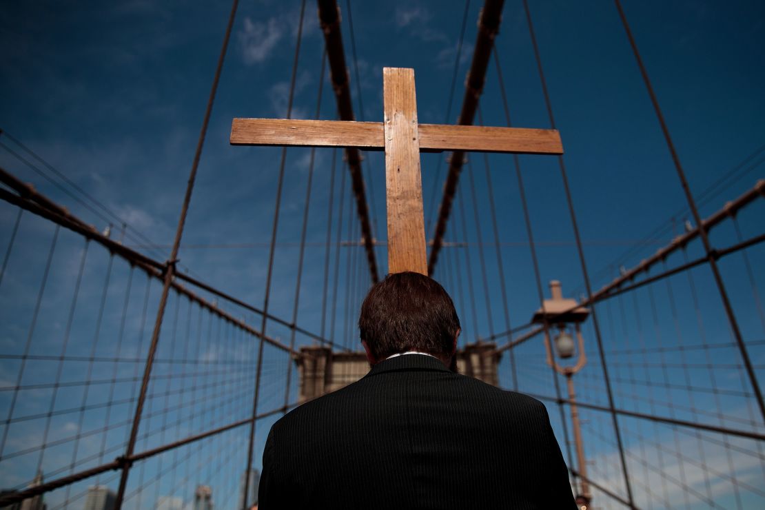 The Way of the Cross procession makes its way across the Brooklyn Bridge on Good Friday, April 14, 2017, in New York City. The Way of the Cross is a traditional Catholic procession recalling the suffering and death of Jesus Christ and often includes Gospel readings and choral music along the way.