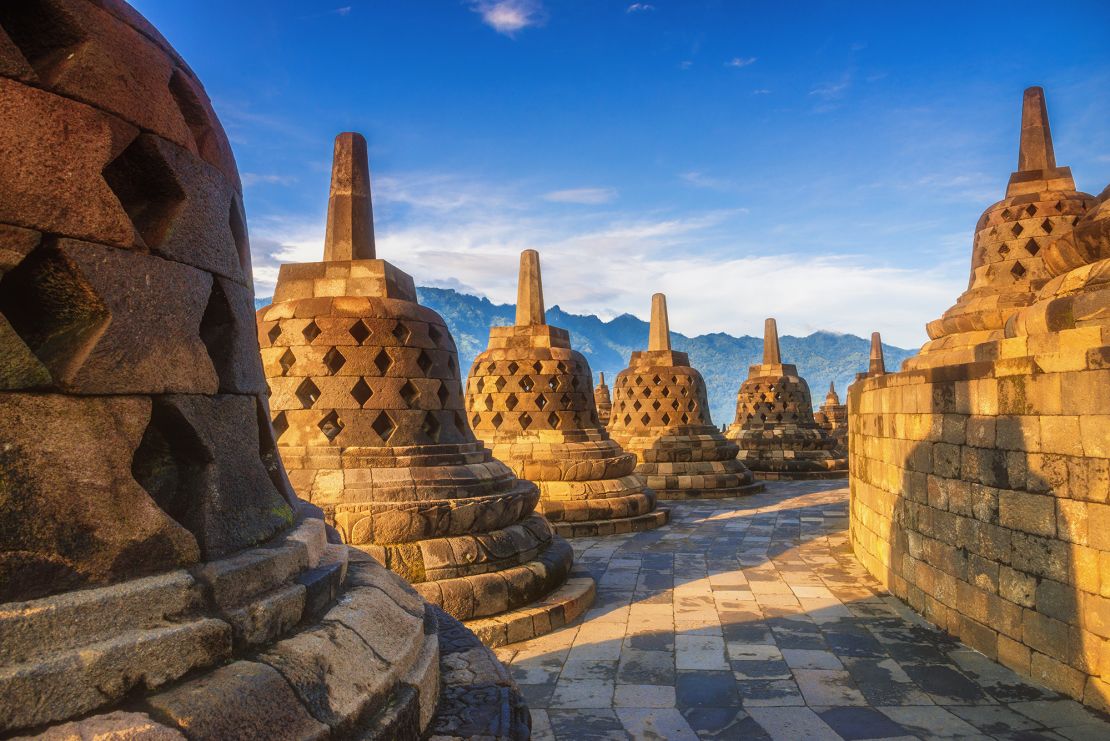 Stone stupas in a row at Borobudur, the world's largest Buddhist temple.