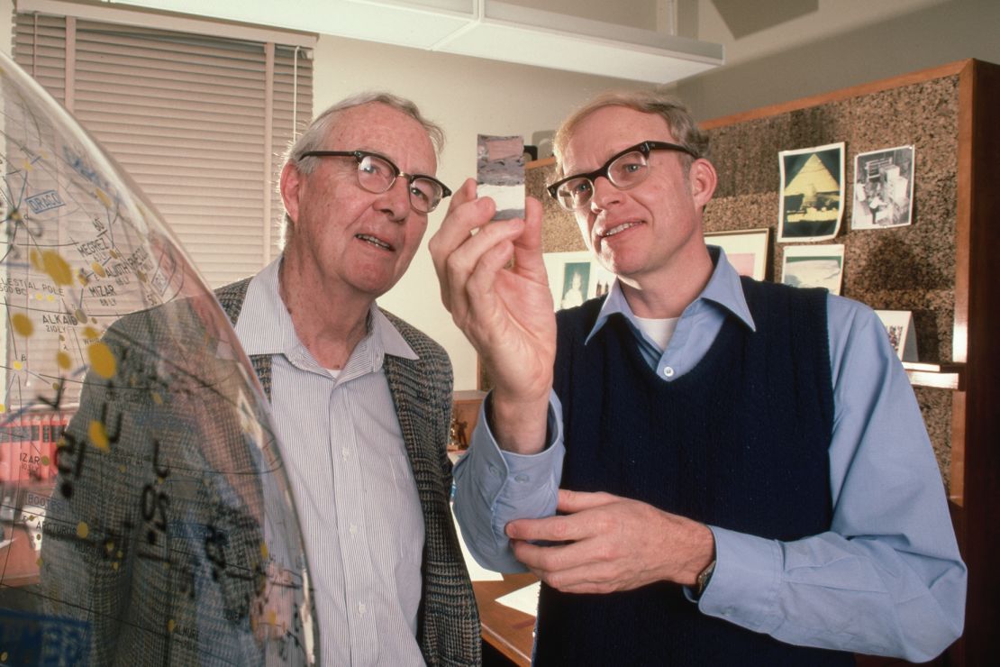The late physicist Luis Alvarez (left) and Walter Alvarez, professor of Earth and planetary science at the University of California, Berkeley, view a sample of an iridium layer deposit. Based on this layer, the father-and-son research team postulated in a 1980 study that a giant asteroid hit Earth in the Cretaceous Period.