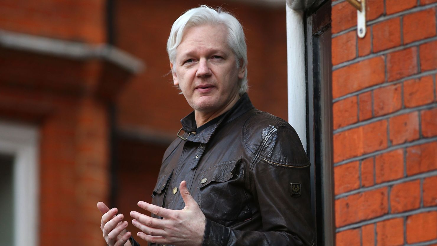 In this 2017 photo, Julian Assange speaks to the media from the balcony of the Embassy Of Ecuador on May 19, 2017 in London, England.