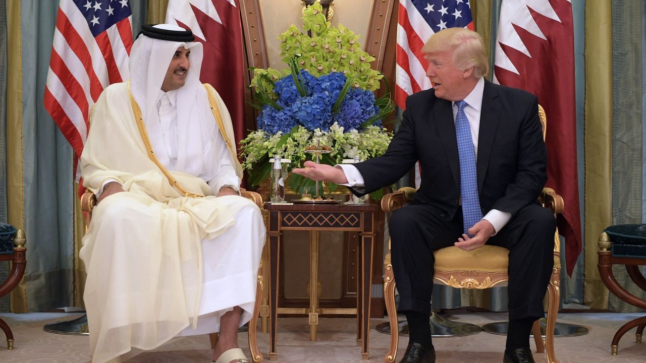 US President Donald Trump (R) and Qatar's Emir Sheikh Tamim Bin Hamad Al-Thani take part in a bilateral meeting at a hotel in Riyadh on May 21, 2017. (Photo by MANDEL NGAN / AFP) (Photo by MANDEL NGAN/AFP via Getty Images)          