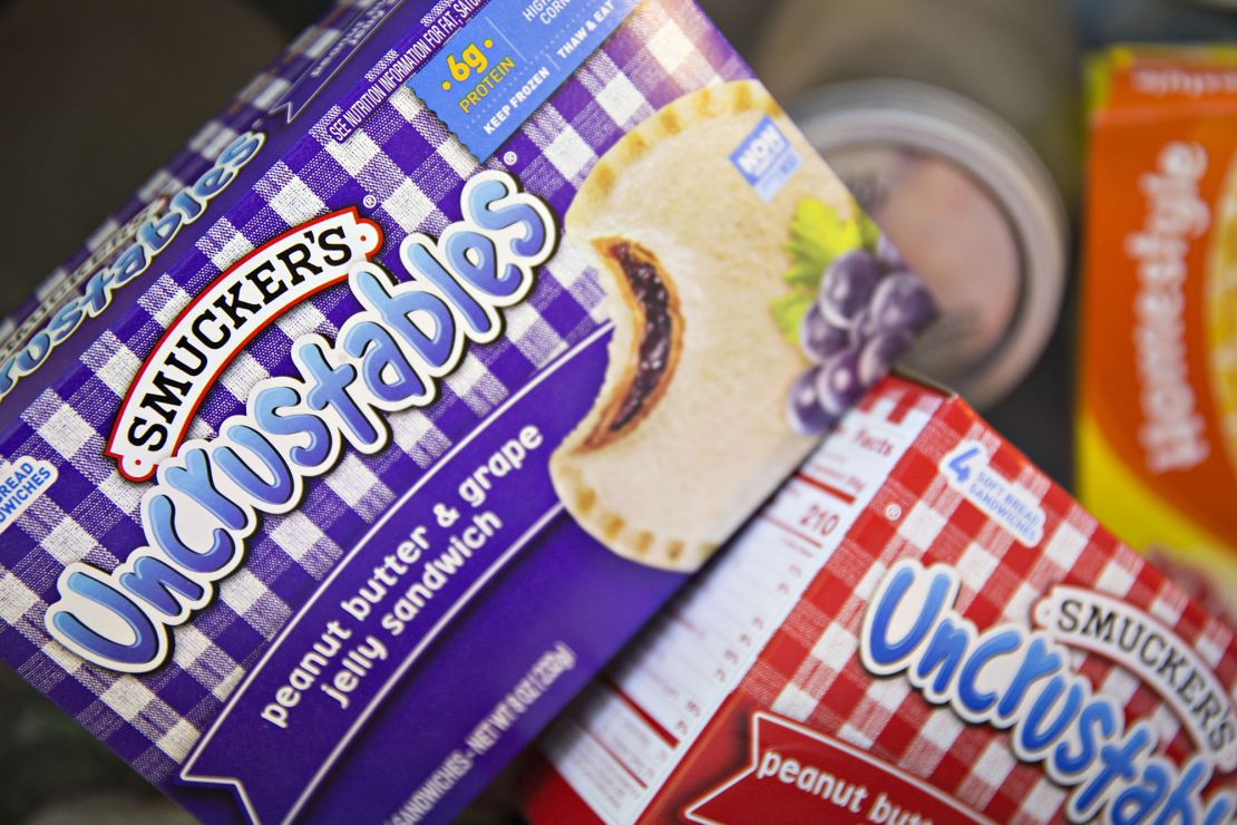 A box of J.M. Smucker Co. Smucker's Uncrustables brand peanut butter and grape jelly sandwiches is arranged for a photograph in Tiskilwa, Illinois, U.S., on Tuesday, June 6, 2017.