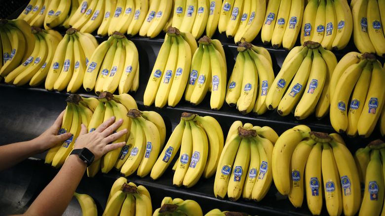An employee arranges Chiquita Brands International Inc. bananas in the produce department inside a Kroger Co. grocery store in Louisville, Kentucky, on Wednesday, June 14, 2017.