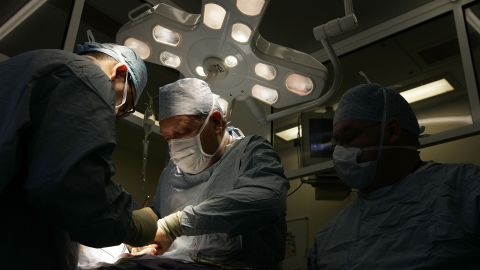 BIRMINGHAM, UNITED KINGDOM - JUNE 09:  Consultant Surgeon Andrew Ready and his team conducts] a live donor kidney transplant at The Queen Elizabeth Hospital Birmingham on June 9, 2006, in Birmingham, England. Kidney failure patient Carol Playfair was given the chance of life when her sister Tracey Playfair offered one of her own perfect kidneys to help save the life of Carol. The operation at The QE Hospital, part of The University Hospital's Trust was one of 1500 live donor transplants carried out in the United Kingdon every year. Despite the introduction of Donor Cards, there are still too few kidneys available to help all those who require a transplant, thereby producing a waiting list and the only chance of survival is by live donor.  (Photo by Christopher Furlong/Getty Images)