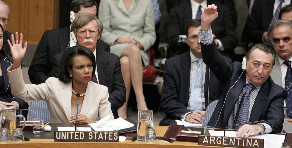 United States Secretary of State Condoleezza Rice (L) and Argentinian Ambassador Cesar Mayoral raise their hands to vote on UN Resolution 1701 at the UN headquarters in New York City, on August 11, 2006.